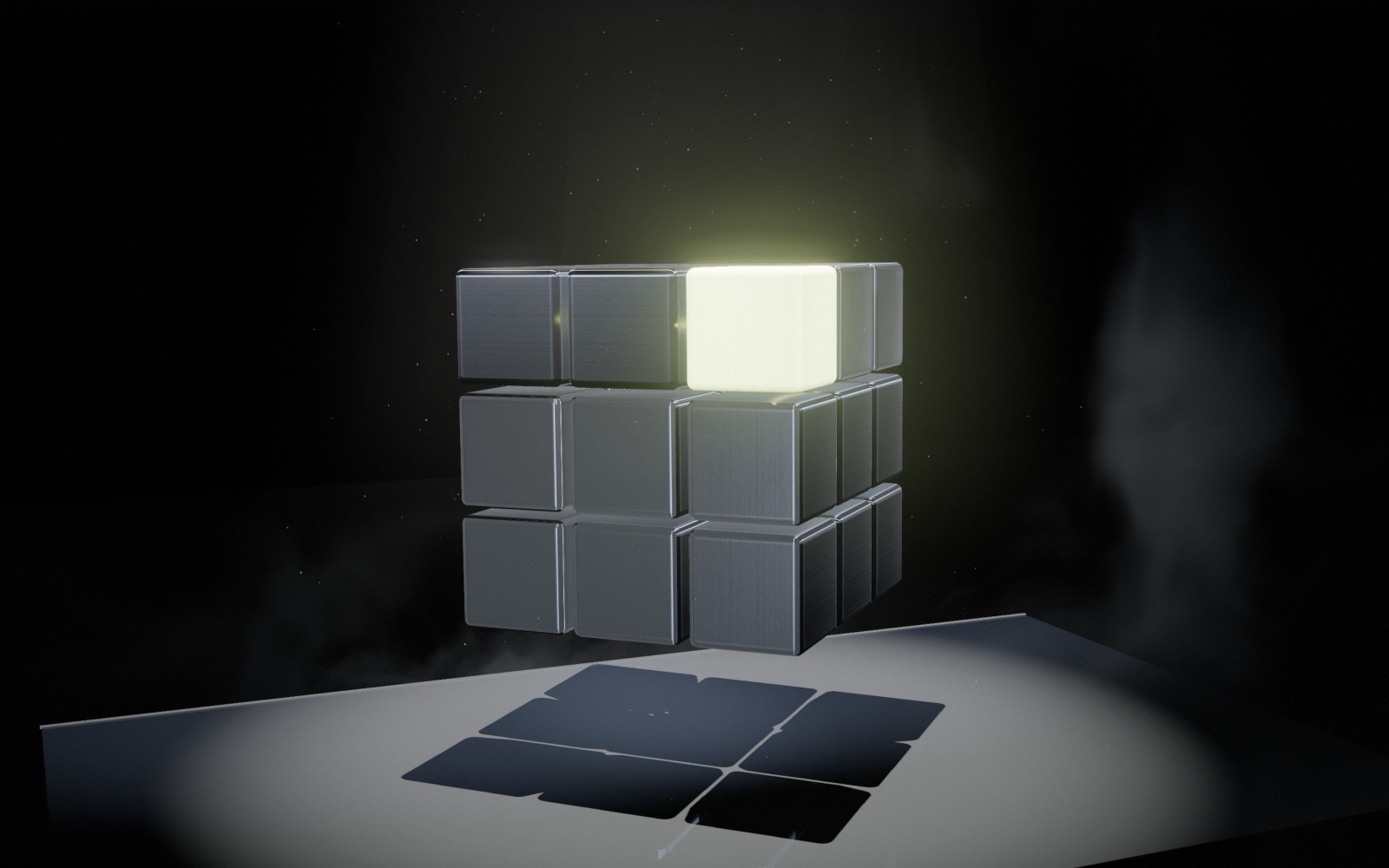 The titanium cube seen from behind, its lime pixel glowing on the top corner, casting a sharp shadow on the lit plinth.